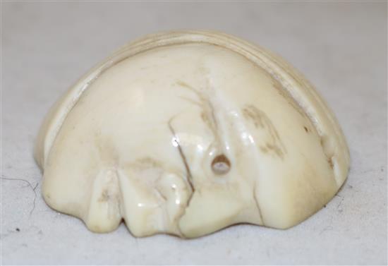 A Japanese ivory netsuke of a reclining man and an ivory mask, possibly Hotei, 19th/early 20th century, 3.9cm and 3.6cm